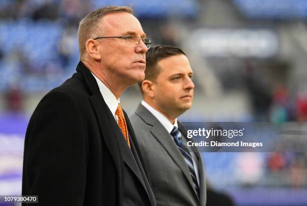 General manager John Dorsey and assistant general manager Eliot Wolf of the Cleveland Browns on the field prior to a game against the Baltimore...