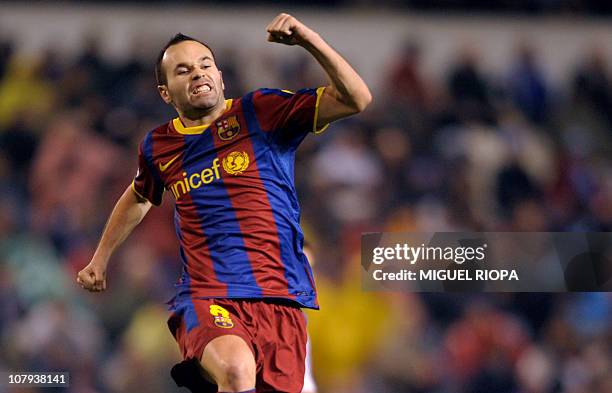 Barcelona's midfielder Andres Iniesta celebrates after scoring against Deportivo during the Spanish league football match RC Deportivo de la Coruna...