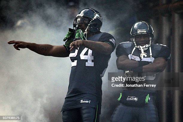 Marshawn Lynch of the Seattle Seahawks and Justin Forsett pose during player introductions before taking on the New Orleans Saints during the 2011...