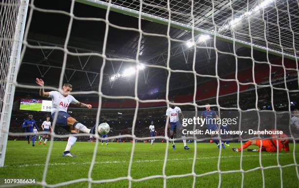 Toby Alderweireld of Tottenham Hotspur clears the ball off the line after a save from Paulo Gazzaniga during the Carabao Cup semi-final first leg...