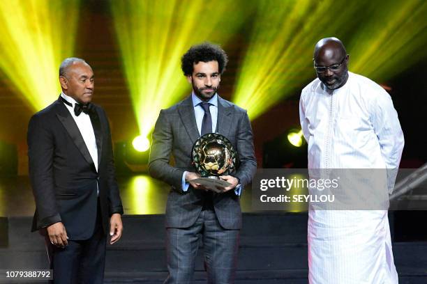 Confederation of African Football President Ahmad Ahmad poses after he handovered the 2018 African Footballer of the Year Award also called Ballon...