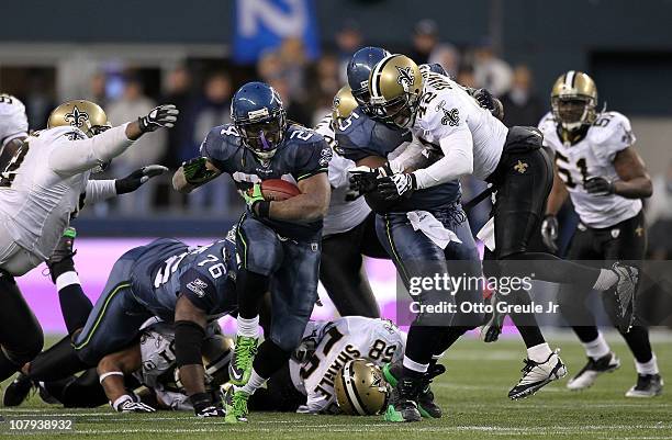 Running back Marshawn Lynch of the Seattle Seahawks runs for a 67-yard touchdown run in the fourth quarter against the New Orleans Saints during the...