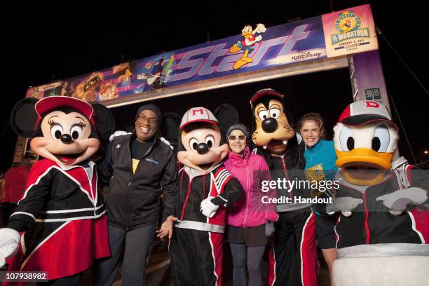 In this handout image provided by Disney, 'Today Show' hosts Al Roker, Meredith Vieira and Natalie Morales pose with Disney characters at the start...