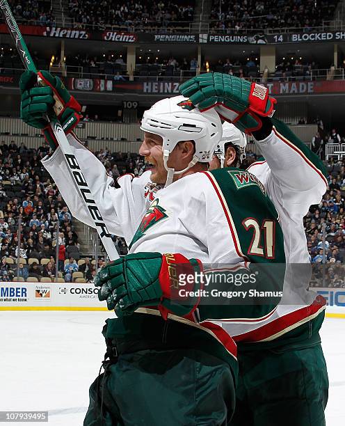 Kyle Brodziak of the Minnesota Wild celebrates his empty net goal against the Pittsburgh Penguins on January 8, 2011 at Consol Energy Center in...