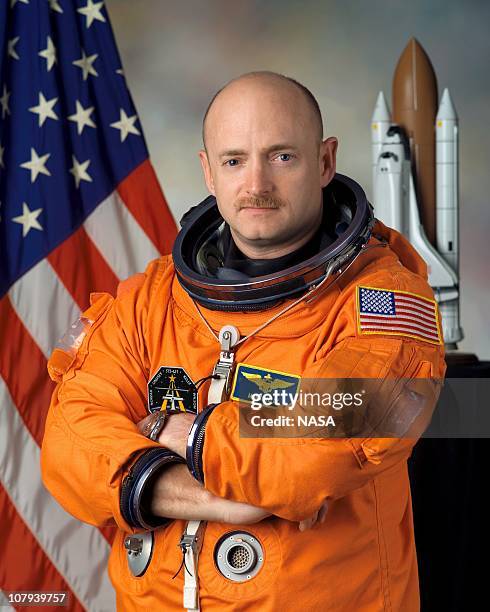 In this handout image provided by NASA, astronaut Mark E. Kelly poses for a photo January 5, 2005 in Houston, Texas. Mark E. Kelly's wife, U.S. Rep....