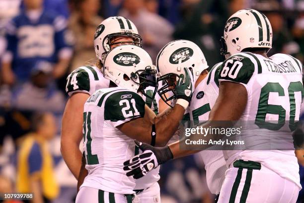 LaDainian Tomlinson of the New York Jets celebrates with Robert Turner and D'Brickashaw Ferguson after Tomlnson scored a 1-yard touchdown in the...