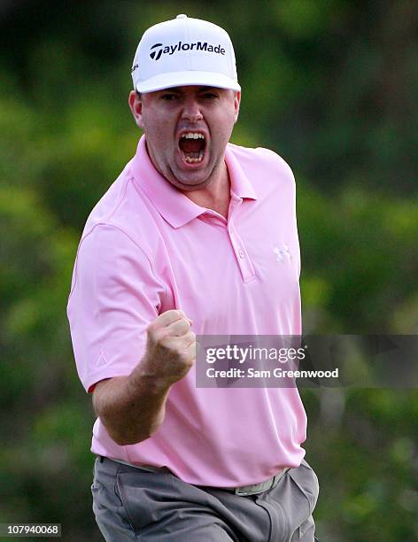 Robert Garrigus reacts to an eagle putt on the 18th hole during the third round of the Hyundai Tournament of Champions at the Plantation course on...