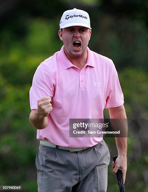 Robert Garrigus reacts to an eagle putt on the 18th hole during the third round of the Hyundai Tournament of Champions at the Plantation course on...