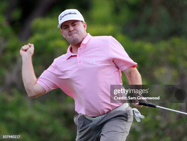 Robert Garrigus reacts to an eagle putt on the 18th hole during the third round of the Hyundai Tournament of Champions at the Plantation course on...