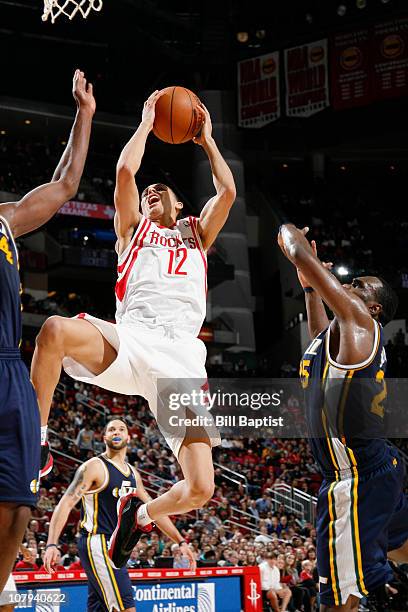 Kevin Martin of the Houston Rockets shoots the ball over Al Jefferson of the Utah Jazz on January 8, 2011 at the Toyota Center in Houston, Texas....