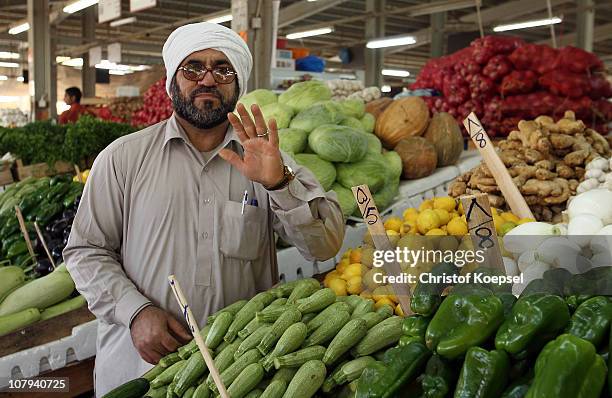 An Iranian is seen at the fruit market on January 8, 2011 in Doha, Qatar. The FIFA World Cup 2022 will takes place in Qatar.