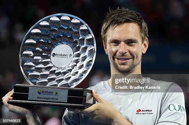 Robin Soderling of Sweden holds the winners trophy as he celebrates victory after his finals match against Andy Roddick of the USA during day eight...