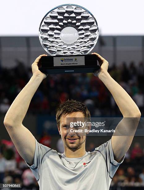 Robin Soderling of Sweden holds the winners trophy as he celebrates victory after his finals match against Andy Roddick of the USA during day eight...