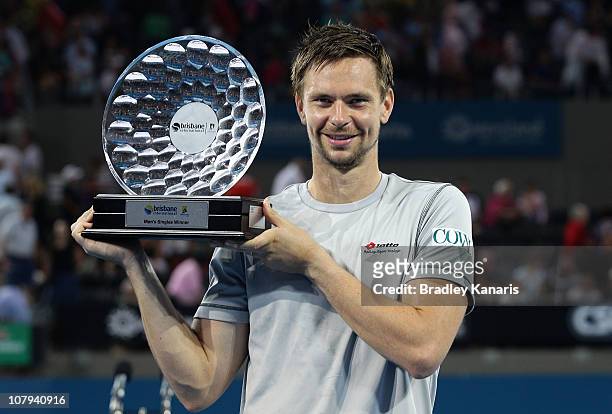 Robin Soderling of Sweden holds the winners trophy as he celebrates victory after his finals match against Andy Roddick of the USA during day eight...