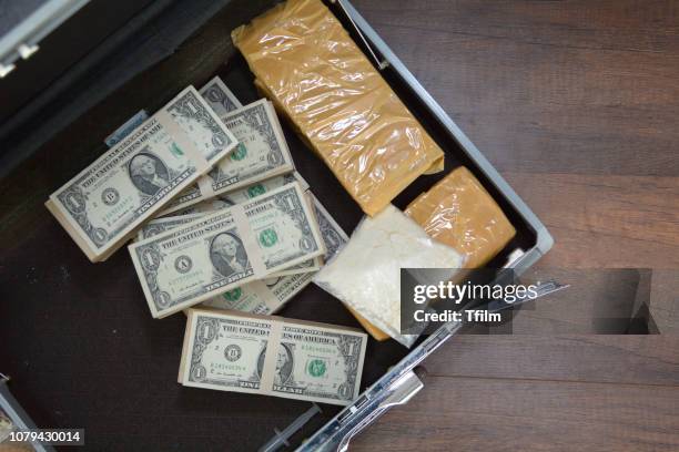 drug and dollar money in suitcase, drug trafficking, crime. - cocaine stock pictures, royalty-free photos & images
