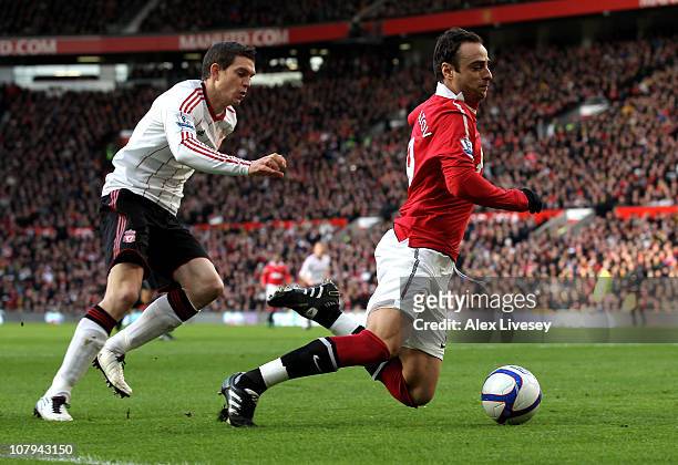 Daniel Agger of Liverpool brings down Dimitar Berbatov of Manchester United to concede a penalty during the FA Cup sponsored by E.ON 3rd round match...