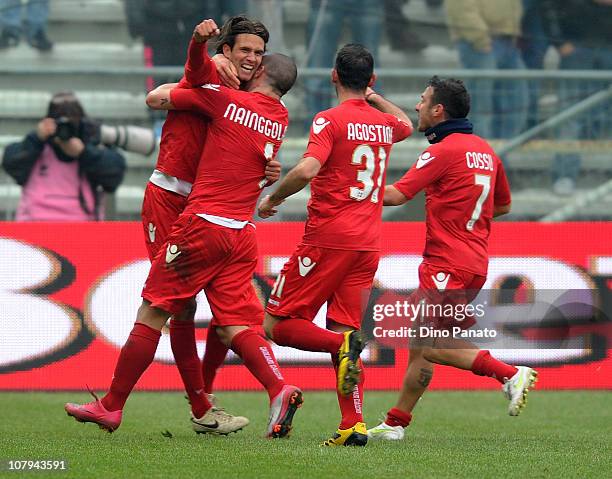 Robert Acquafresca of Cagliari celebrates with Radja Nainggolan and team-mates after scoring the opening goal of the Serie A match between Parma FC...