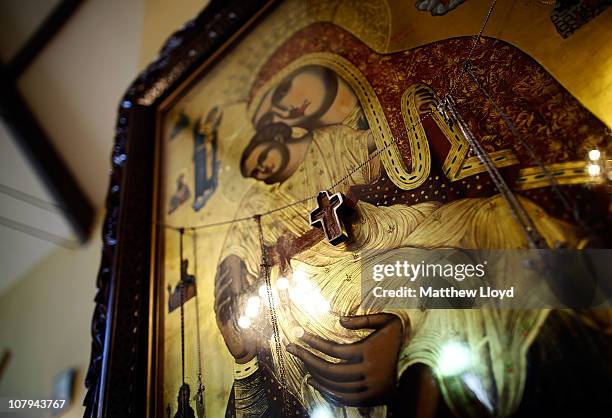 Cross hangs on an icon as His Eminence Gregorios, Archbishop of Thyateira and Great Britain presides over the divine liturgy at the Parish of the...