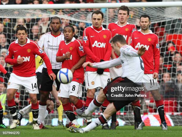 Fabio Aurelio of Liverpool takes a free kick during the FA Cup sponsored by Eon third round match at Old Trafford on January 9, 2011 in Manchester,...