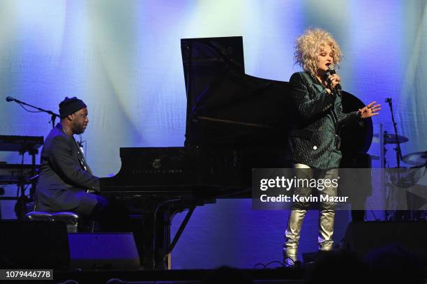 Cyndi Lauper and Robert Glasper perform onstage during Cyndi Lauper's 8th Annual 'Home For The Holidays' Benefit Concert at Beacon Theatre on...