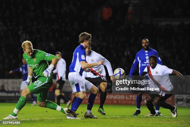 Joe Hart the Manchester City goalkeeper fumbles the ball to let Andy King of Leicester City score his sides second goal during the FA Cup sponsored...