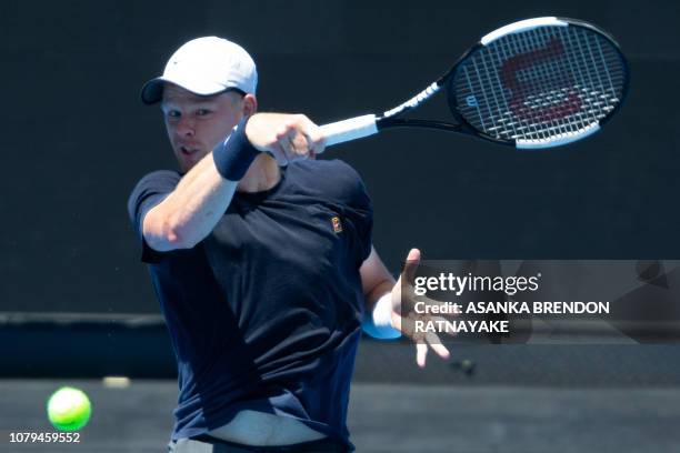 Britain's Kyle Edmund plays a forehand shot during a practice session in Melbourne on January 9 ahead of the Australian Open tennis tournament. / --...