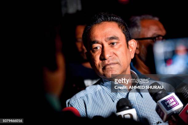 In this photo taken on January 8, 2019 Maldives' former president Abdulla Yameen speaks to the media outside a police station where he had been...