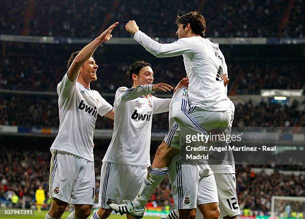 Kaka of Real Madrid celebrates with fellow goalscorer Cristiano Ronaldo, Xabi Alonso and Mesut Ozil after scoring Real's fourth goal during the La...
