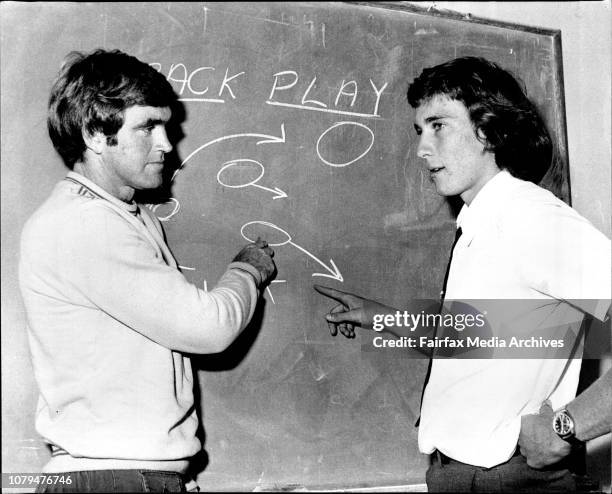 Sports Teacher of Northmead High and Parramatta 1st grade Rugby Union player Rod Batterham, gives Tony Melrose a puple of the Northmead high school a...