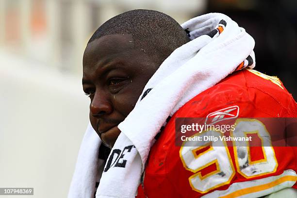 Defensive tackle Shaun Smith of the Kansas City Chiefs cries on the bench after losing 30-7 to of the Baltimore Ravens in the 2011 AFC wild card...