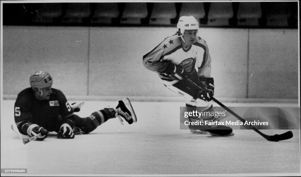 Ice Hocker: Sydney vs Adelaide at Macquarrie center Ice Rink SaturdayAugust 13.Jerry Ponton of Sydney carrying the puck past a fallen Allan Malste of Adelaide.