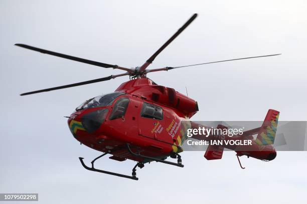 Britain's Prince William, Duke of Cambridge , arrives in a red London Air Ambulance at the Royal London Hospital in east London on January 9, 2019. -...