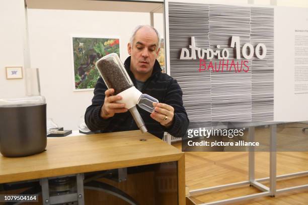 January 2019, Thuringia, Weimar: Project manager Hans-Peter Grossmann shows a kitchen machine R2B2 with manual drive in the exhibition "Our Bauhaus"...