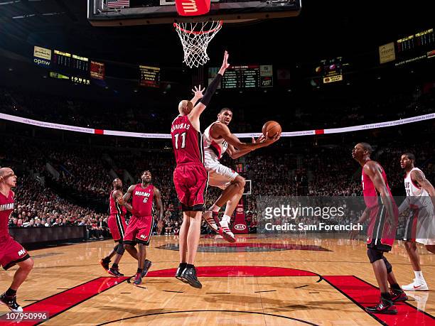 Nicolas Batum of the Portland Trail Blazers goes up for a shot against Zydrunas Ilgauskas of Miami Heat during a game on January 9, 2011 at the Rose...