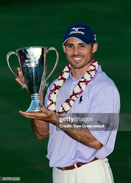 Jonathan Byrd poses with the trophy after winning the Hyundai Tournament of Champions at the Plantation course on January 9, 2011 in Kapalua, Hawaii.