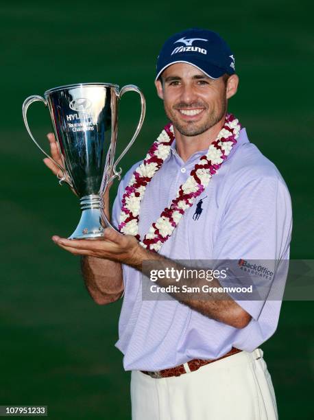 Jonathan Byrd poses with the trophy after winning the Hyundai Tournament of Champions at the Plantation course on January 9, 2011 in Kapalua, Hawaii.