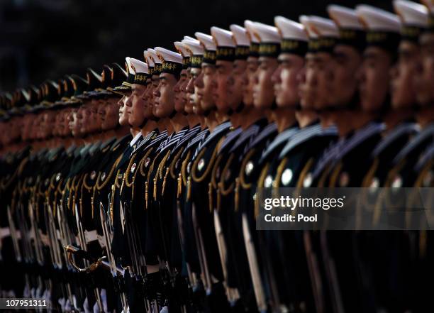 Members of a Chinese military honor guard stand at attention during a welcoming ceremony for U.S. Secretary of Defense Robert Gates at the Bayi...