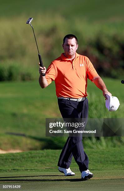 Robert Garrigus walks to the 18th green during the final round of the Hyundai Tournament of Champions at the Plantation course on January 9, 2011 in...