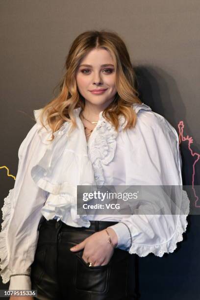 American actress Chloe Grace Moretz poses backstage during the Coach 2019 early autumn collection fashion show 'Coach Lights Up Shanghai' on December...