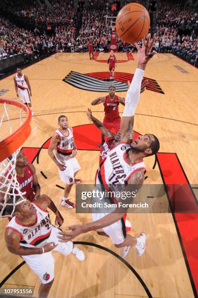 LaMarcus Aldridge of the Portland Trail Blazers grabs a rebound during a game against the Miami Heat on January 9, 2011 at the Rose Garden Arena in...