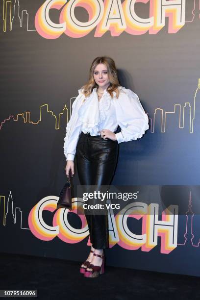 American actress Chloe Grace Moretz poses backstage during the Coach 2019 early autumn collection fashion show 'Coach Lights Up Shanghai' on December...