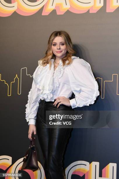 American actress Chloe Grace Moretz poses backstage during the Coach 2019 early autumn collection fashion show 'Coach Lights Up Shanghai' on December...