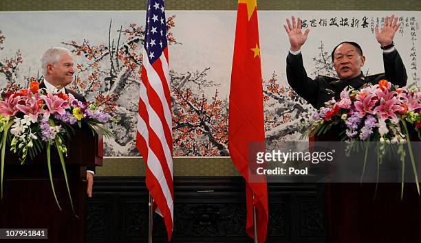 Secretary of Defense Robert Gates watches China's Minister of National Defense General Liang Guanglie end a joint news conference at Bayi Building...