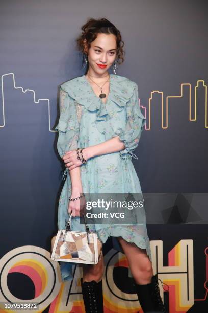 American-Japanese model Kiko Mizuhara poses backstage during the Coach 2019 early autumn collection fashion show 'Coach Lights Up Shanghai' on...