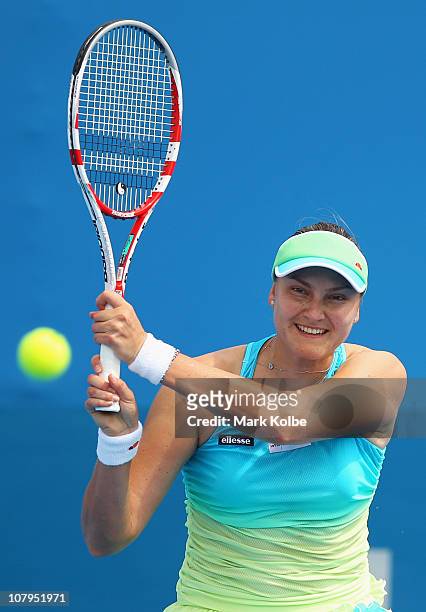 Nadia Petrova of Russia plays a backhand in her match against Barbora Zahlavova Strycova of the Czech Republic during day two of the 2011 Medibank...