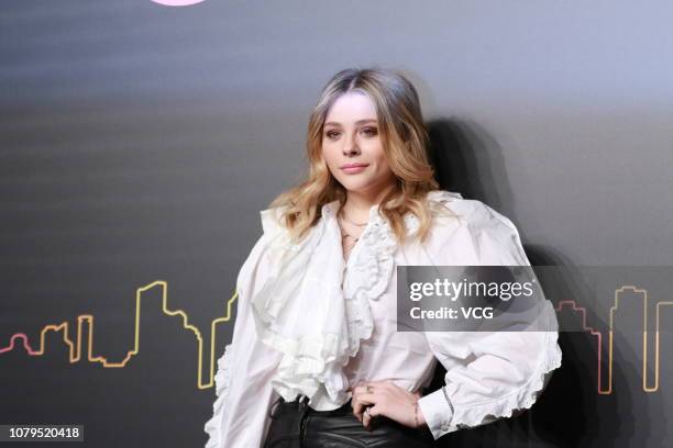 American actress Chloe Grace Moretz poses backstage during the Coach 2019 early autumn collection fashion show 'Coach Lights Up Shanghai' on December...