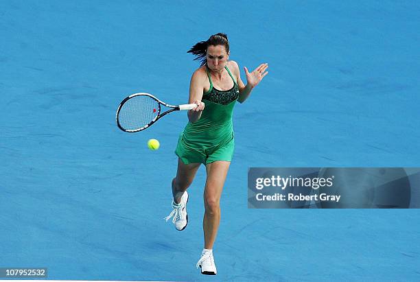 Jelena Jankovic of Serbia plays a forehand in her match against Aravane Rezai of France during day two of the 2011 Medibank International at Sydney...