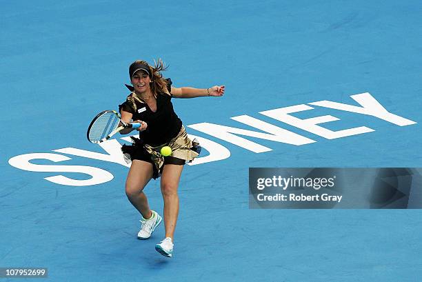 Aravane Rezai of France plays a forehand in her match against Jelena Jankovic of Serbia during day two of the 2011 Medibank International at Sydney...