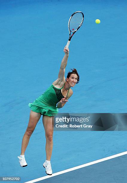 Jelena Jankovic of Serbia serves in her match against Aravane Rezai of France during day two of the 2011 Medibank International at Sydney Olympic...