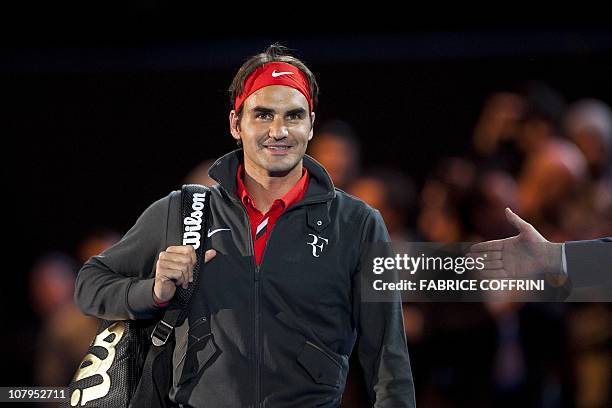 Switzerland's Roger Federer looks on as he arrives to play against Spain's Rafael Nadal during a charity game on December 21, 2010 in Zurich. "The...